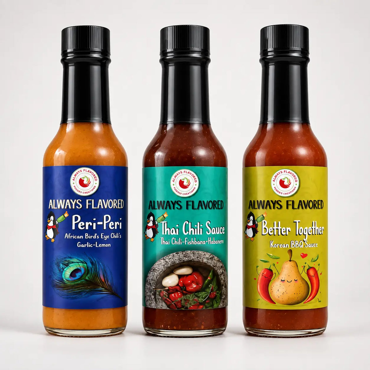 Three glass bottles of always flavored hot sauce with black caps featuring peri-peri, thai chili, and korean bbq sauce labels
