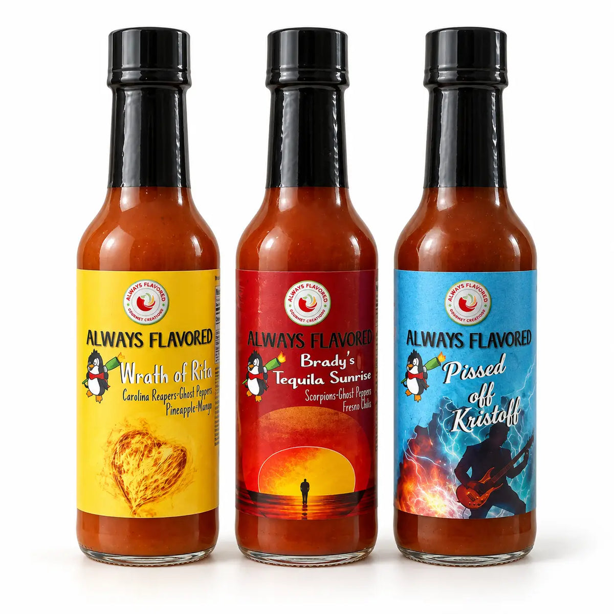 Three glass bottles of fafo heat pack hot sauce with black caps and colorful labels featuring brady’s tequila sunrise and penguins