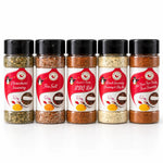Five clear plastic shakers with black caps and penguin labels in the Flavor First spice rack for tasty bbq and taco tuesday