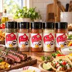 Five clear plastic spice jars with black lids and red labels in flavor first spice rack perfect for tasty bbq and taco tuesday