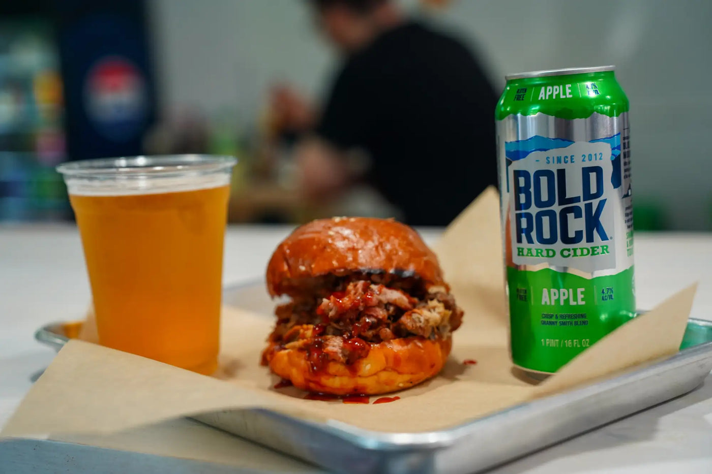 Green and silver can of bold rock apple hard cider.