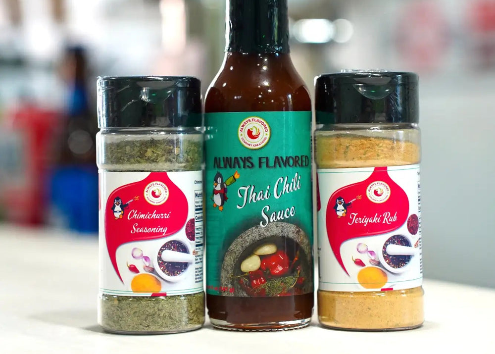 A vibrant green bottle of always flavored thai chili sauce with a black cap and label featuring an illustration of chili peppers, garlic, and herbs.
